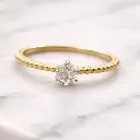 ANILLO Sencillo, Oro Amarillo de 18 Kilates y un Brillante Central